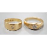 Two 18ct gold and gypsy set solitaire diamond rings, largest size T/U, gross weight 11.3 grams.