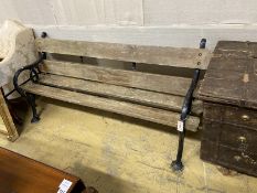A Victorian painted cast iron slatted garden bench, length 180cm, depth 56cm, height 82cm