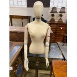 A Victorian style canvas, beech and composition mannequin on telescopic stand