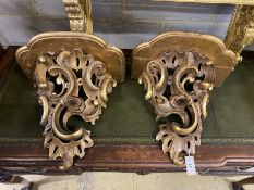 A pair of 19th century carved giltwood roccoco wall brackets, width 46cm, depth 30cm, height 44cm