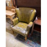 A green leather library armchair, width 73cm, depth 78cm, height 89cm