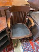 An early 20th century beech swivel desk chair, width 56cm, depth 48cm, height 92cm