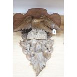 A carved gilt wood ‘eagle’ wall bracket, 62cm long