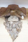 A carved gilt wood ‘eagle’ wall bracket, 62cm long