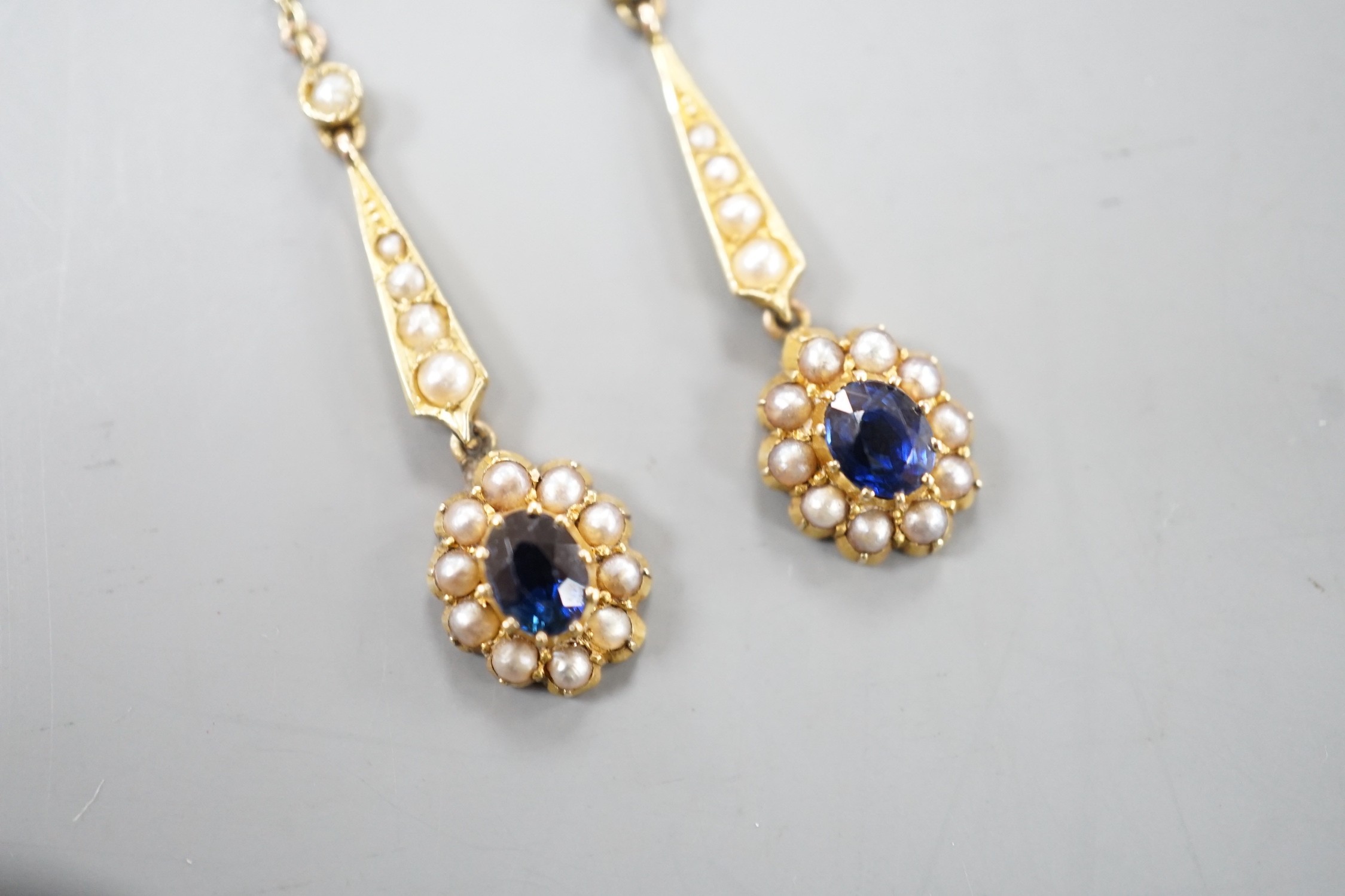 A pair of yellow metal, sapphire and seed pearl set drop earrings. 41mm, gross weight 3.4 grams. - Image 3 of 4