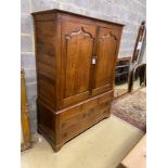 An 18th century and later panelled oak hanging cupboard fitted drawers, width 138cms, depth 56cms,
