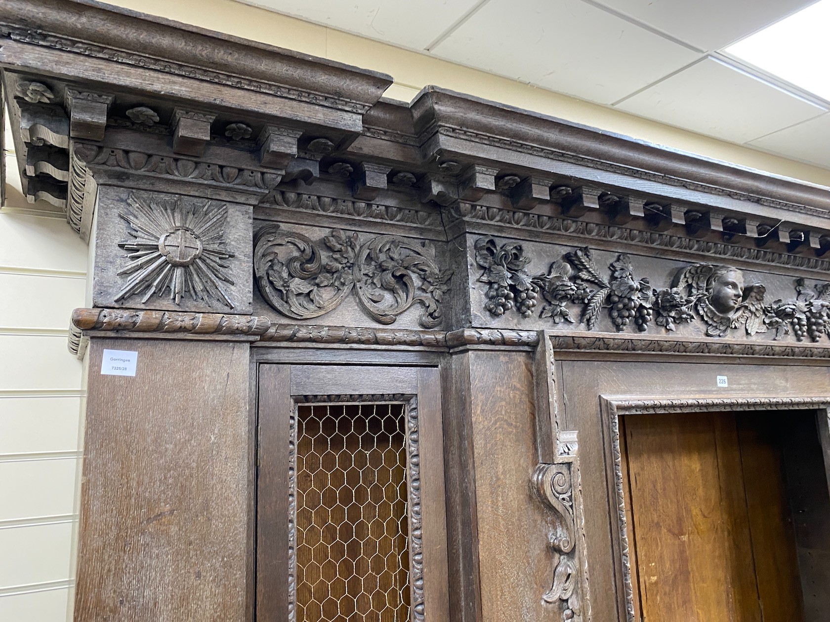 A large 19th century oak breakfront cabinet, with a finely carved frieze, length 280cm, depth - Image 2 of 3