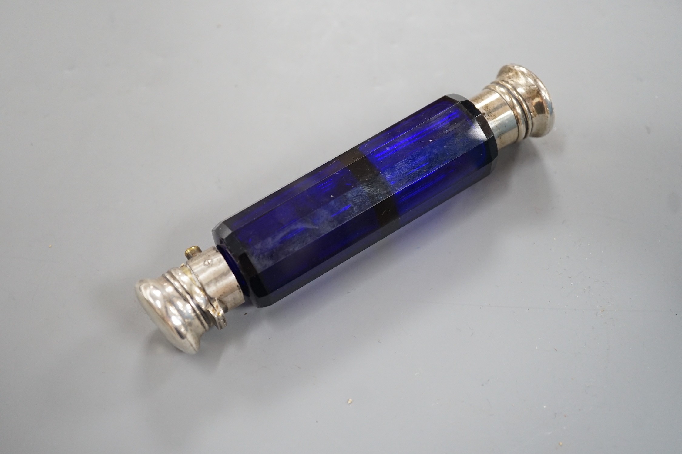 A late Victorian white metal mounted blue glass double ended scent bottle, 13.5cm. - Image 2 of 2