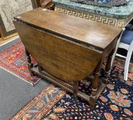 An 18th century oak oval topped gateleg table, width 124cm extended, depth 90cm, height 74cm