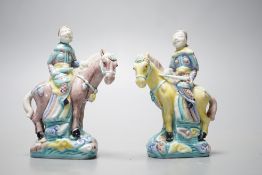 A pair of early 20th century Chinese equestrian groups, 9cm tall