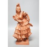 A red composition figure of a Spanish dancer, indistinctly signed to reverse, 34cm tall