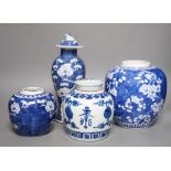 Two Chinese prunus jars, a vase and cover and a a jar and cover, vase and cover 26 cms high