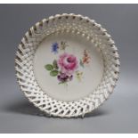 A late 19th century Meissen circular basket border dish with flower decoration, 26cm diameter
