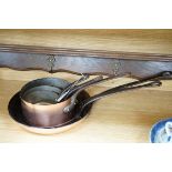 † † Two copper frying pans by Yves Gautier in Villedieu and three saucepans with an oak 5 hook pan