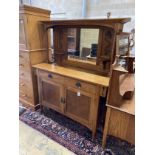 An early 20th century Art Nouveau oak mirrored back sideboard, length 137cm, width 52cm, height