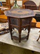 An Indian brass inlaid carved hardwood octagonal topped occasional table, width 62cm, height 62cm