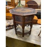 An Indian brass inlaid carved hardwood octagonal topped occasional table, width 62cm, height 62cm