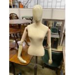 A Victorian style canvas beech and composition mannequin on telescopic stand