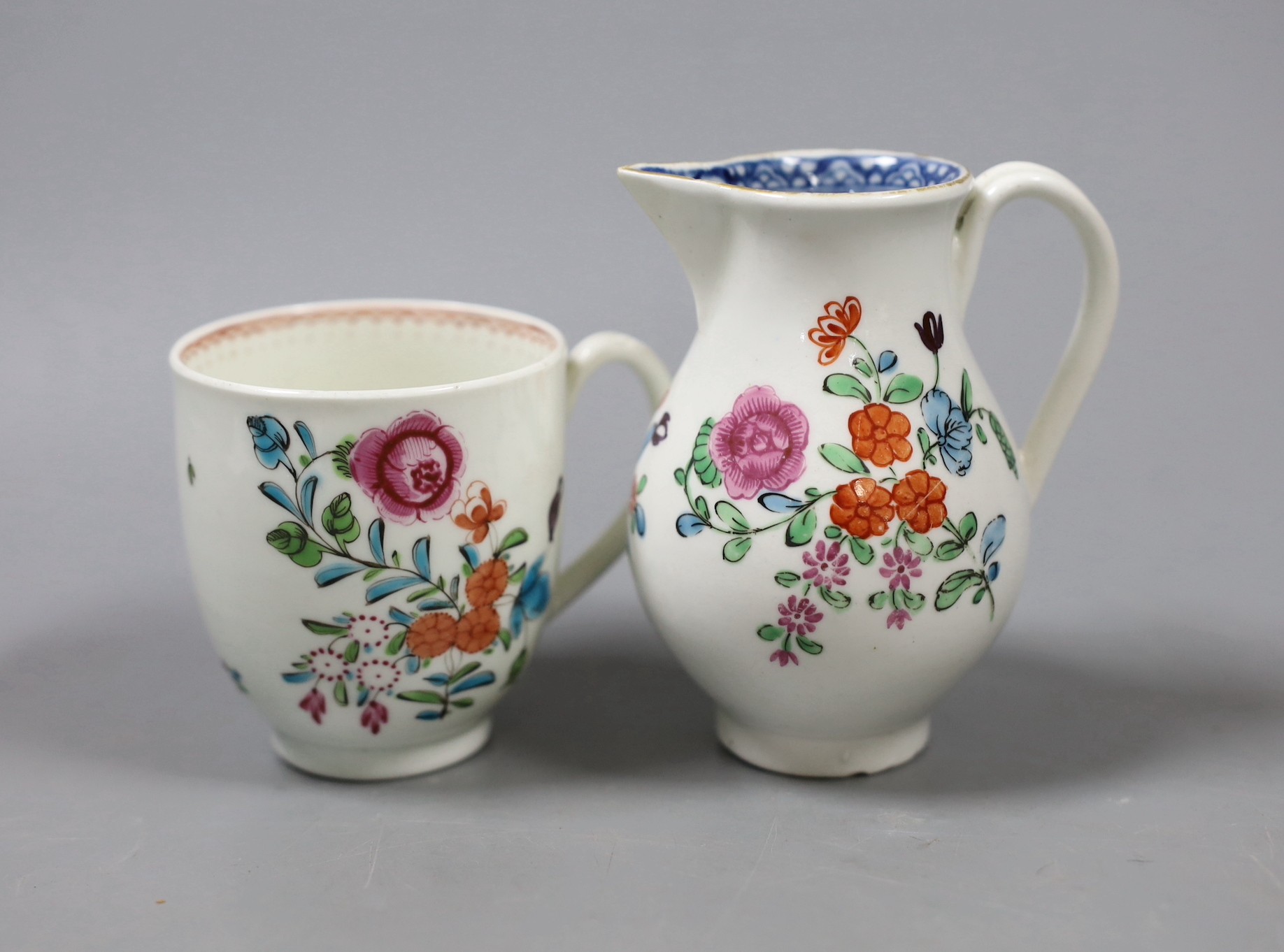 A Worcester sparrow beak jug, enamelled with flowers with an inner underglaze blue border and a