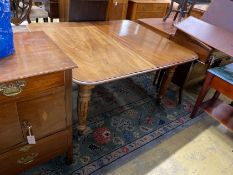 An early Victorian mahogany extending dining table, length 280cm extended, three spare leaves, width