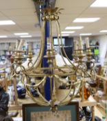 A gilt metal six light basket shaped ceiling chandelier