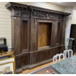 A large 19th century oak breakfront cabinet, with a finely carved frieze, length 280cm, depth