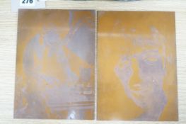 Two copper printing plates depicting two members of The Beatles, Ringo Starr and George Harrison.