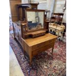 An early 20th century Art Nouveau oak dressing table, width 107cm, depth 54cm, height 155cm