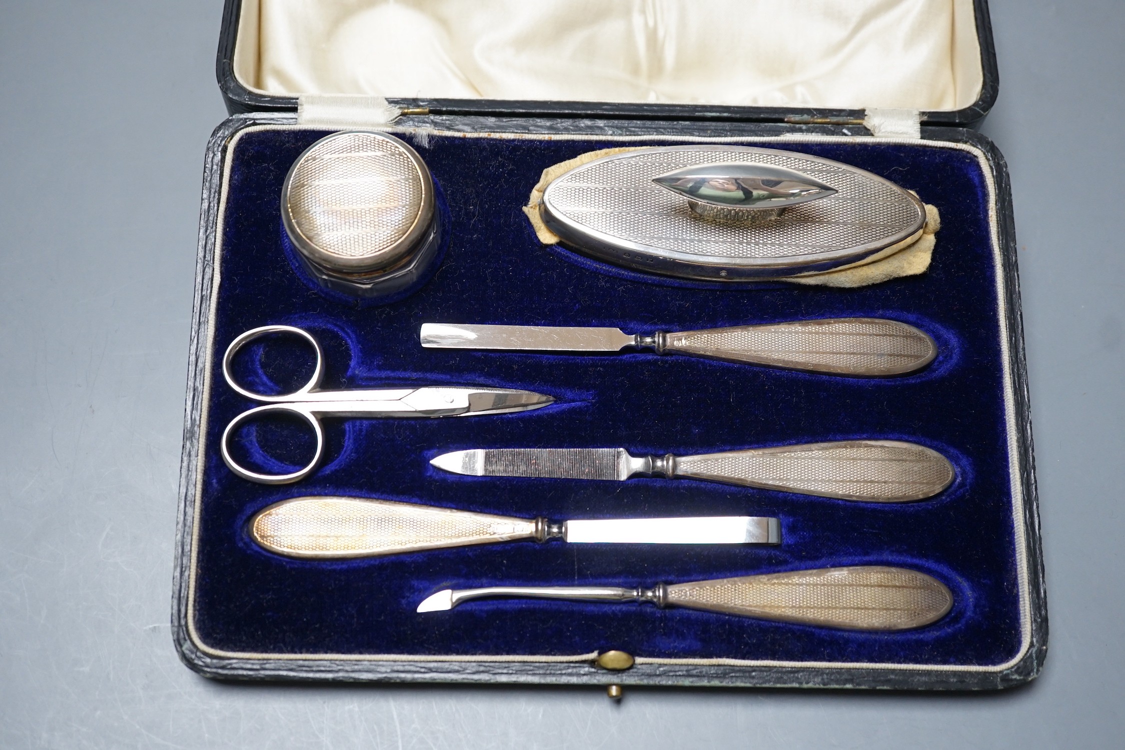 A cased George V silver mounted seven piece manicure set, Birmingham, 1923. - Image 2 of 2
