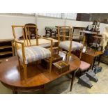 A pair of Gordon Russell oak elbow chairs width 57cms, depth 46cms, height 86cms