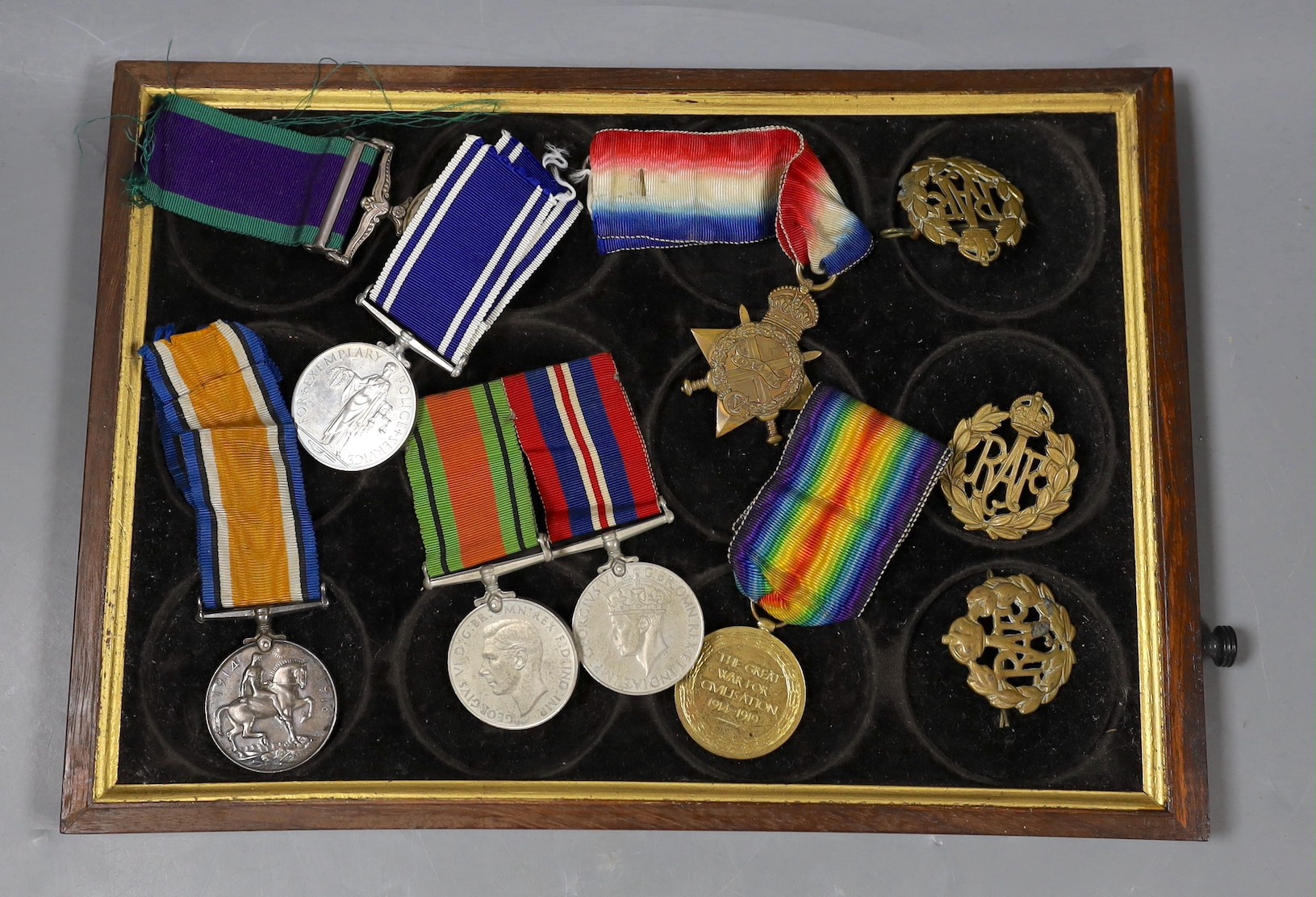 A WWI to Elizabeth II family medal group including WWI trio GSM with Borneo clasp, QEII Police medal