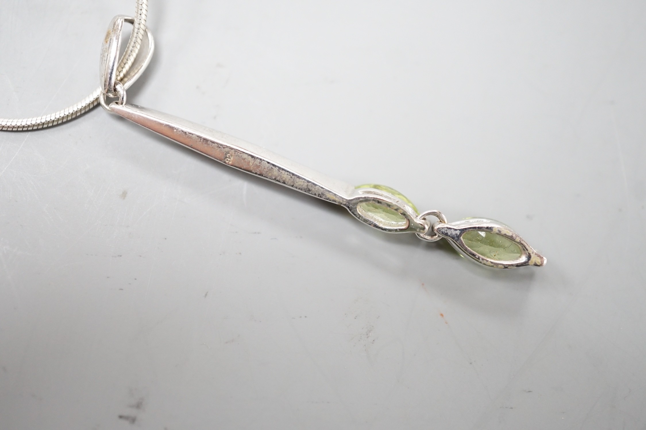 A modern 925 and two stone peridot set pendant,53mm, on a 925 chain, 42cm. - Image 3 of 3