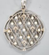 An early 20th century white metal, rose cut diamond chip and seed pearl set openwork pendant,