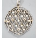 An early 20th century white metal, rose cut diamond chip and seed pearl set openwork pendant,