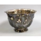 An early 20th century Japanese white metal fruit bowl with applied enamelled foliate decoration(a.