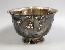 An early 20th century Japanese white metal fruit bowl with applied enamelled foliate decoration(a.