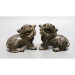 A pair of 18th/19th century Chinese or Japanese bronze lion-dog figures, 8cms high