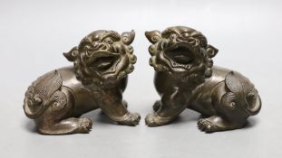 A pair of 18th/19th century Chinese or Japanese bronze lion-dog figures, 8cms high
