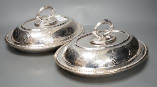 A pair of Edwardian plated engraved oval entree dishes and covers