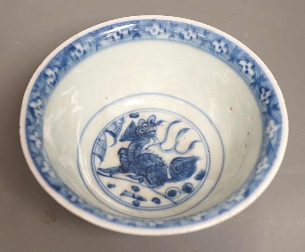 A Chinese late Ming blue and white lion-dog bowl, the base with ‘Made in the Great Ming dynasty’ - Image 6 of 10