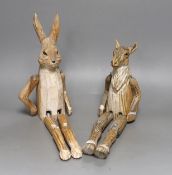 A pair of carved wood animal peg dolls, a hare and a sheep, hare tallest, 43cms high
