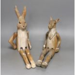 A pair of carved wood animal peg dolls, a hare and a sheep, hare tallest, 43cms high