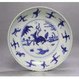 A Chinese late Ming blue and white ‘qilin, crane and rabbit’ dish, Xuande mark, Wanli period,