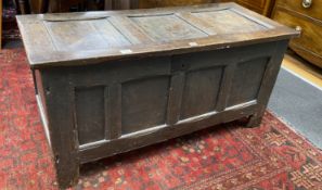 An 18th century panelled oak coffer, length 122cm, depth 52cm, height 59cm