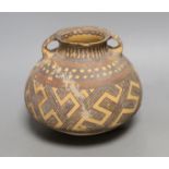 A Chinese pigment painted pottery two handled jar, possibly Neolithic, 14cm high Provenance- the