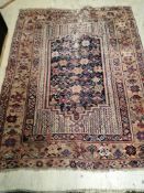 An antique Afshar blue ground rug, worn, 160 x 154cm
