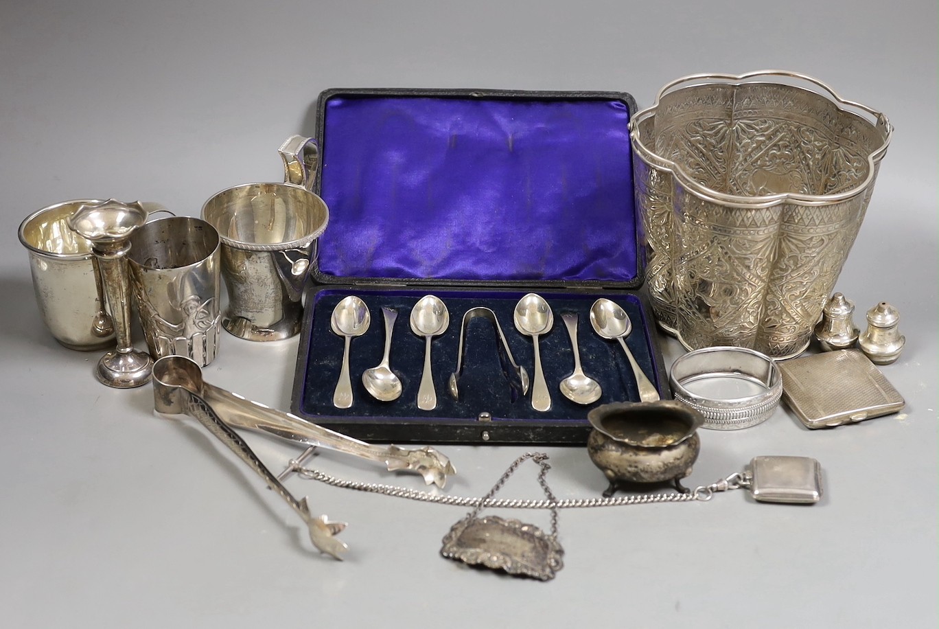 A Siamese sterling two handled ice pail with tongs, height 12.5cm, together with a cased set of