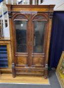 A 19th century French figured walnut glazed two door cabinet, width 101cm, depth 46cm, height 185cm