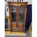 A 19th century French figured walnut glazed two door cabinet, width 101cm, depth 46cm, height 185cm