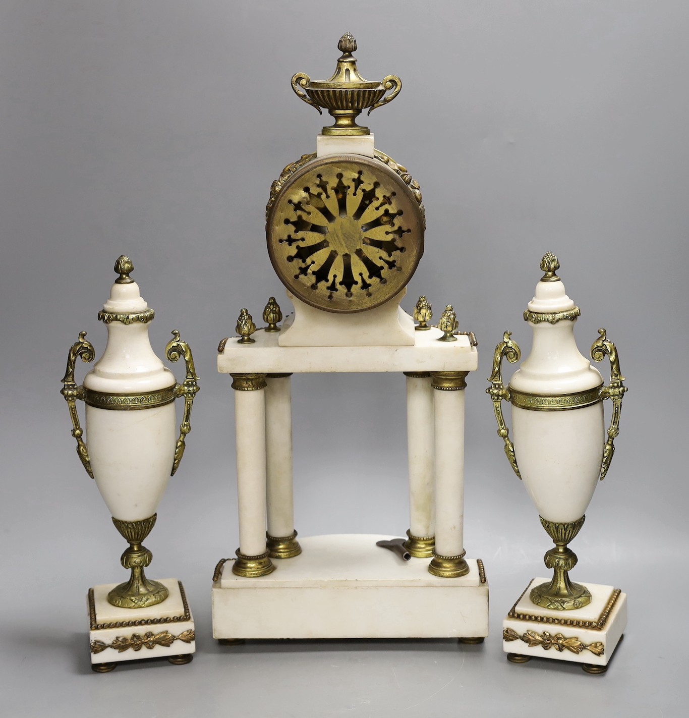 A Louis XVI style white marble and ormolu clock garniture, clock 47cms high - Image 2 of 4